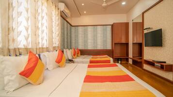 Family Room, 2 Double Beds | Desk, laptop workspace, free WiFi, bed sheets