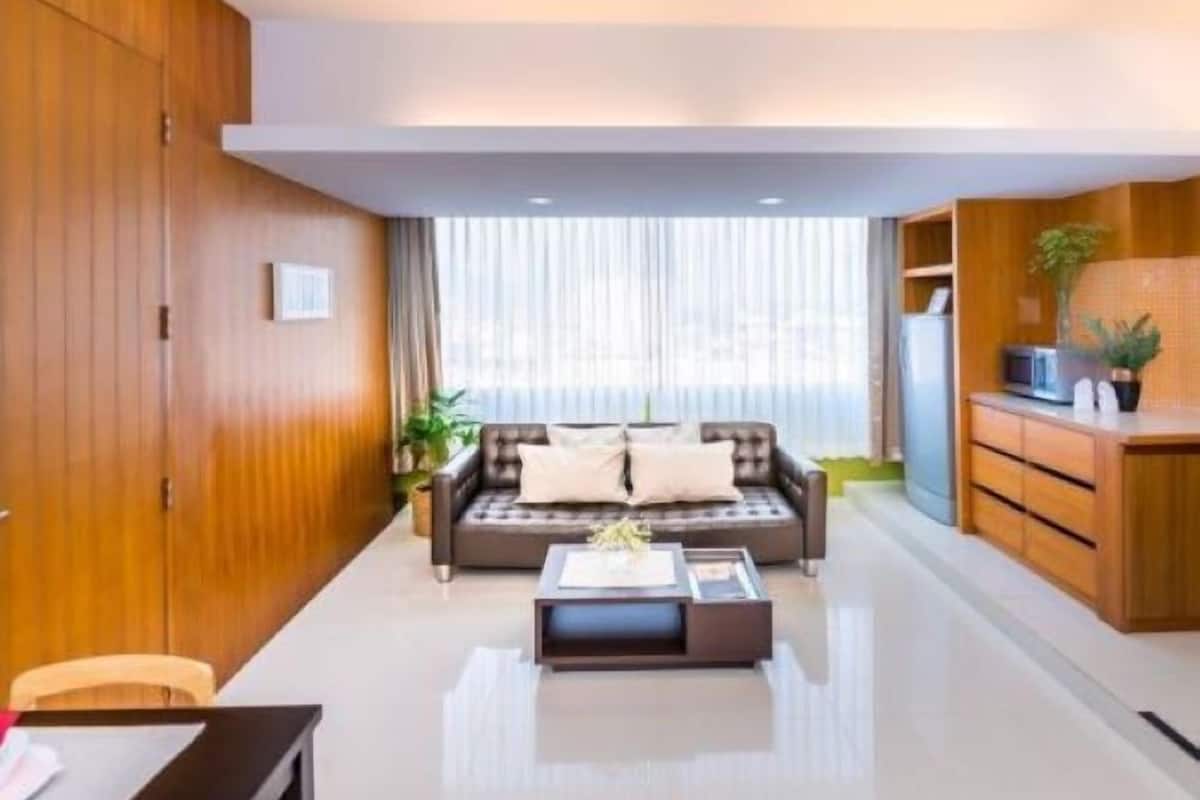one-bedroom corner suite | living area | led tv