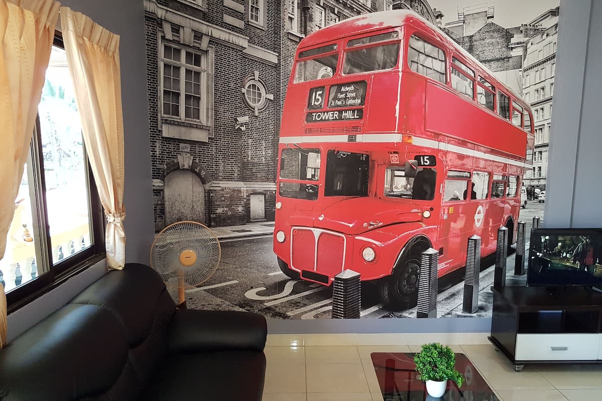 Deluxe Room | Living room | Flat-screen TV