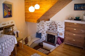 Apartment, 1 Bedroom | Living area | TV, fireplace - Efipoi (South Pelion)