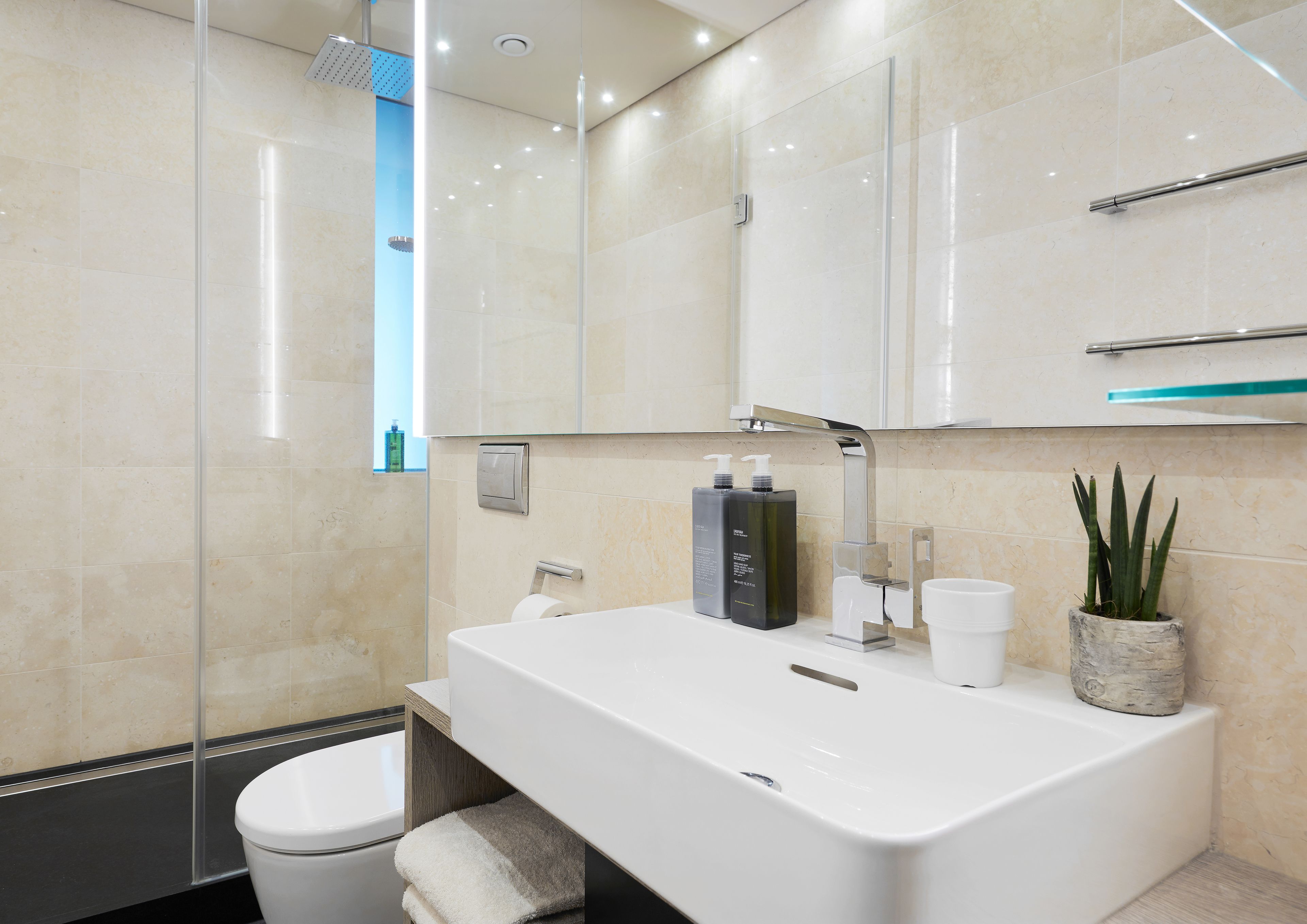 rainfall showerhead, eco-friendly toiletries, hair dryer, towels