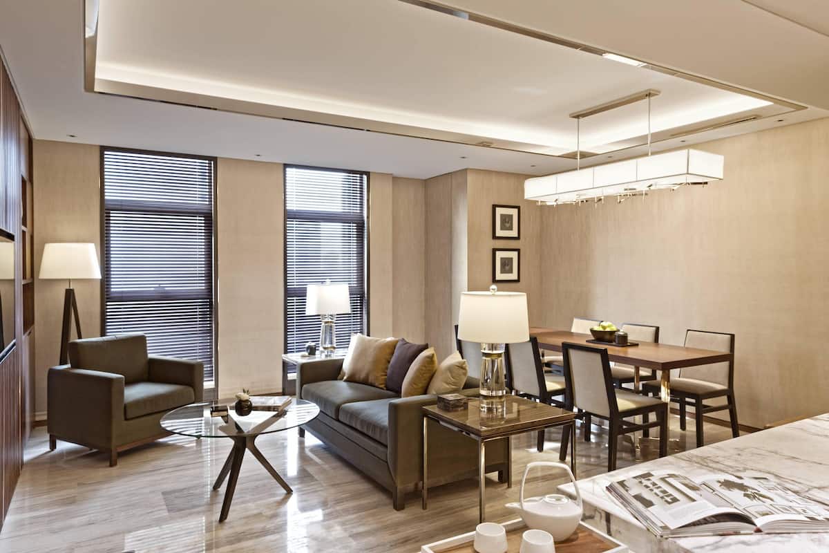Suite, 2 Bedrooms | Living room | 42-inch LCD TV with satellite channels, TV, iPod dock