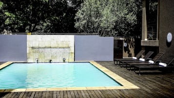 Outdoor pool, pool umbrellas, sun loungers