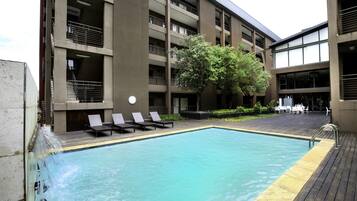 Outdoor pool, pool umbrellas, pool loungers