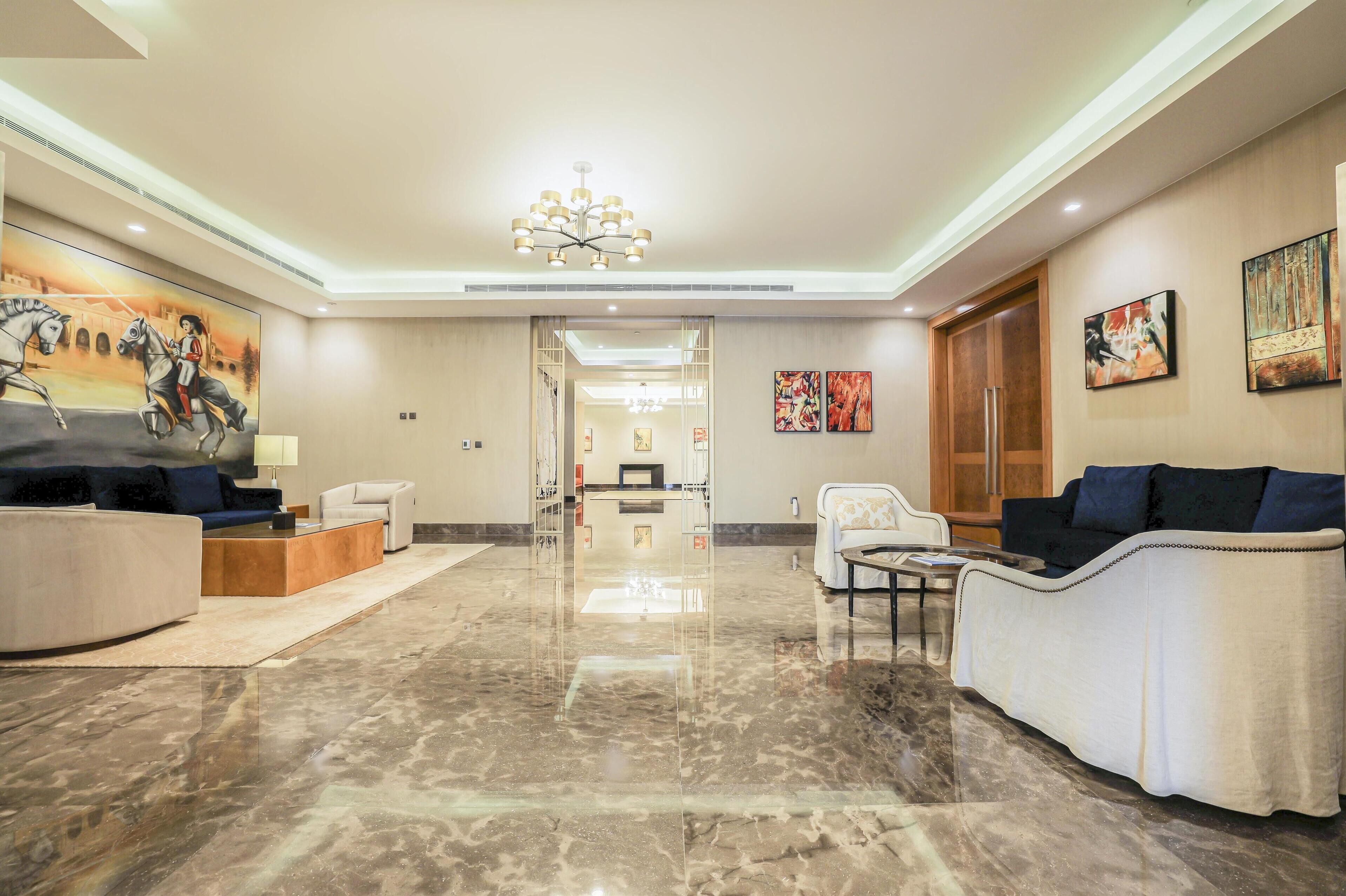 penthouse, multiple beds, city view | living area | 48-inch led tv with cable channels, tv, heated floors