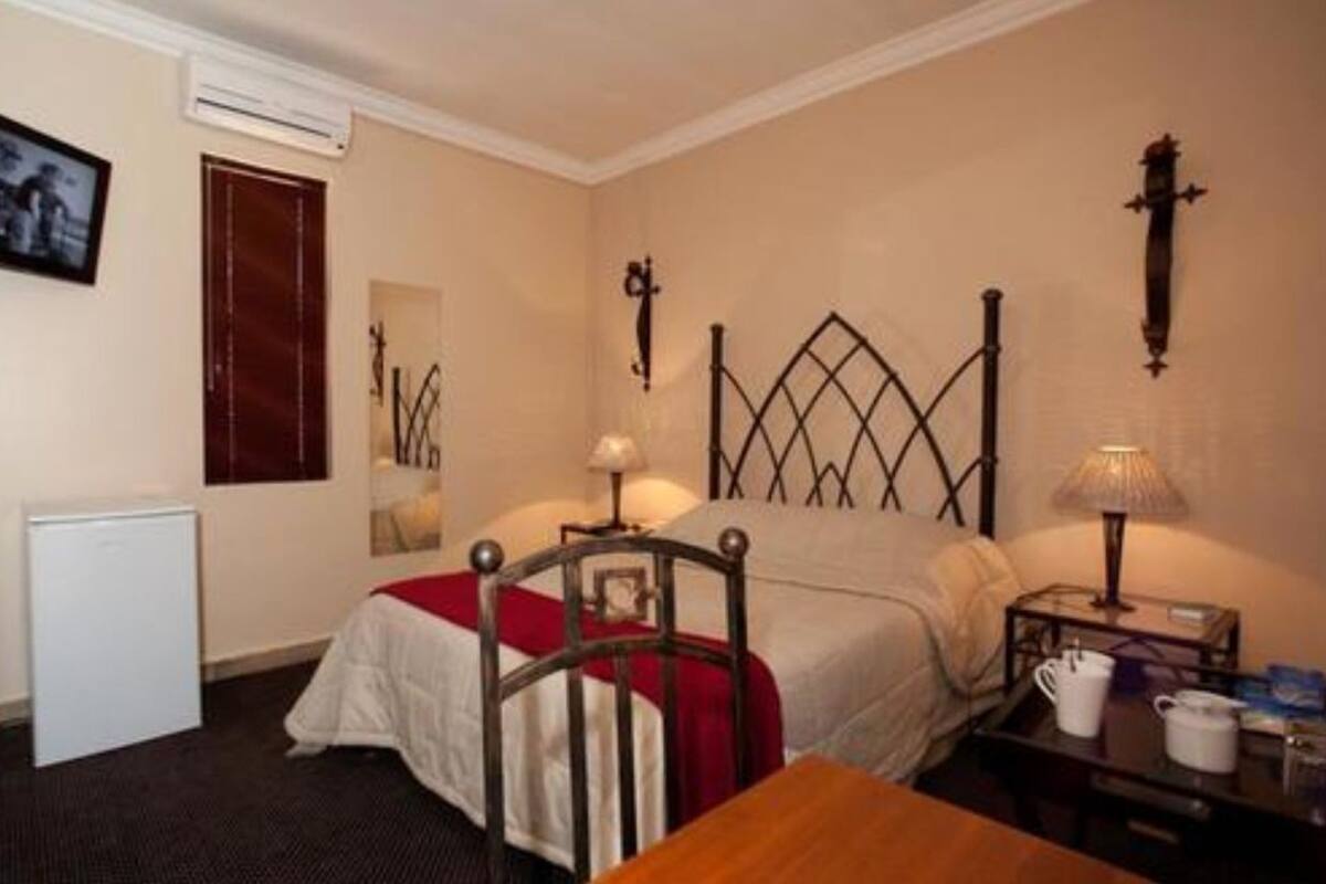 Desk, laptop workspace, blackout curtains, iron/ironing board
