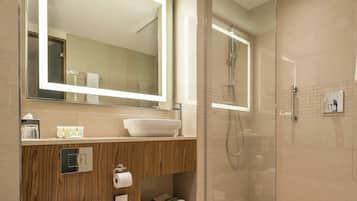 Shower, hair dryer, slippers, towels