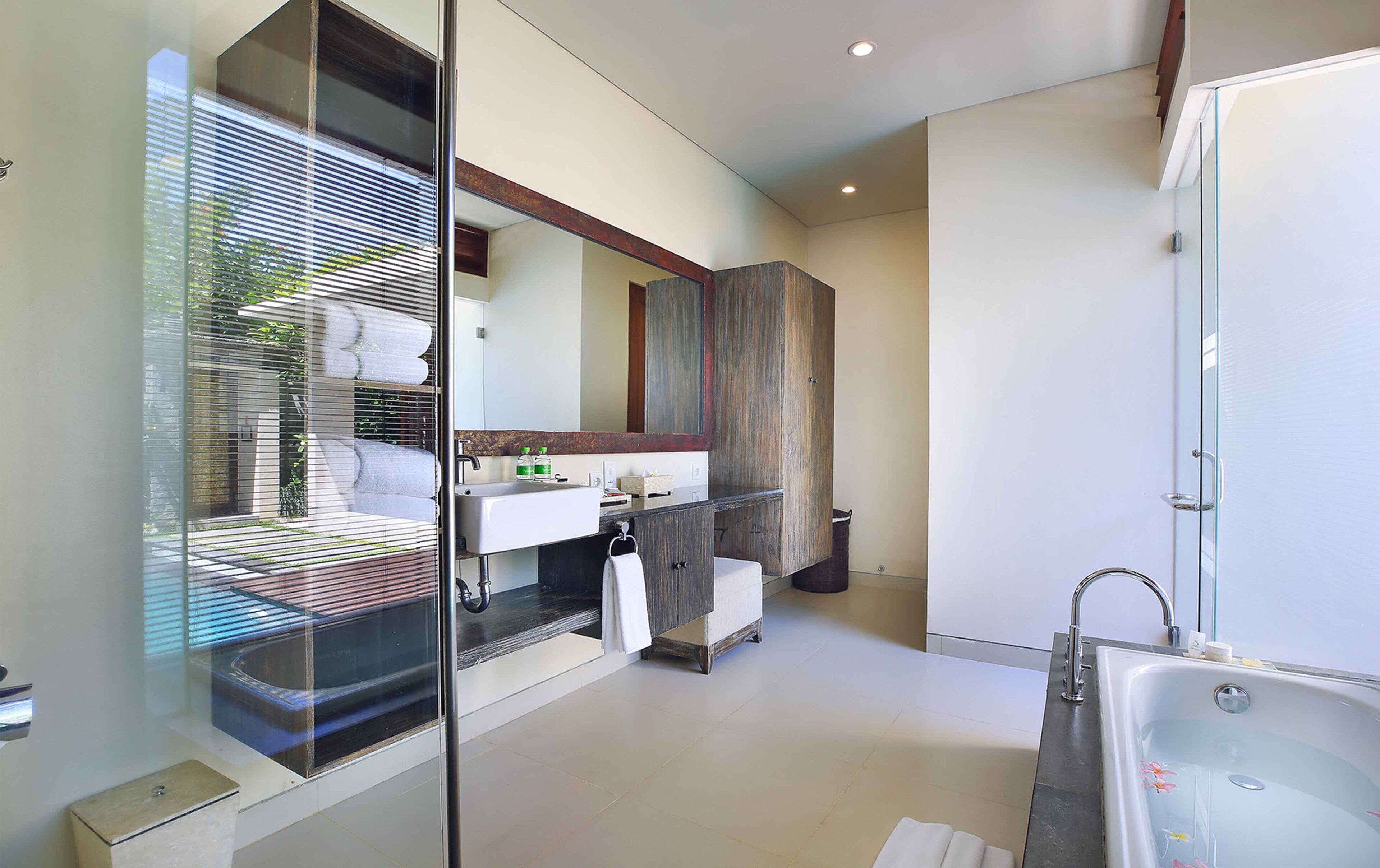 separate bathtub and shower, deep-soaking bathtub, rainfall showerhead