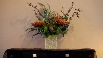 A vase with a floral arrangement on a table.