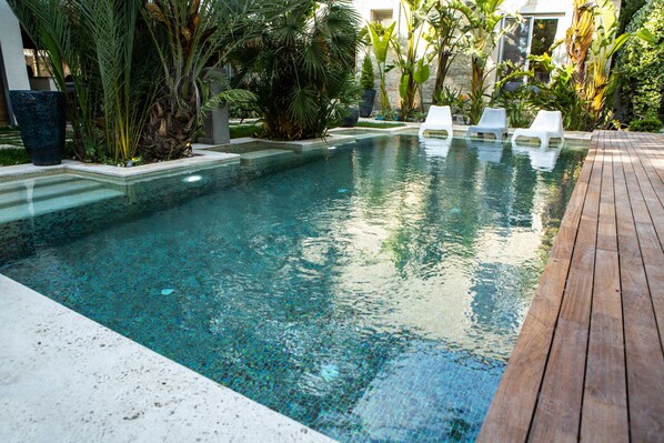 Outdoor pool, free cabanas, pool umbrellas
