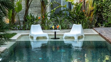 Outdoor pool, free cabanas, pool umbrellas