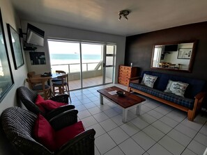 Comfort Apartment, 1 Bedroom, Sea View | Living area | 32-inch flat-screen TV with satellite channels, TV
