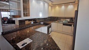 Family Apartment, 3 Bedrooms | Private kitchen | Coffee/tea maker, full-sized fridge, microwave, oven - Blouberg Beachfront Accommodation (Cape Town)