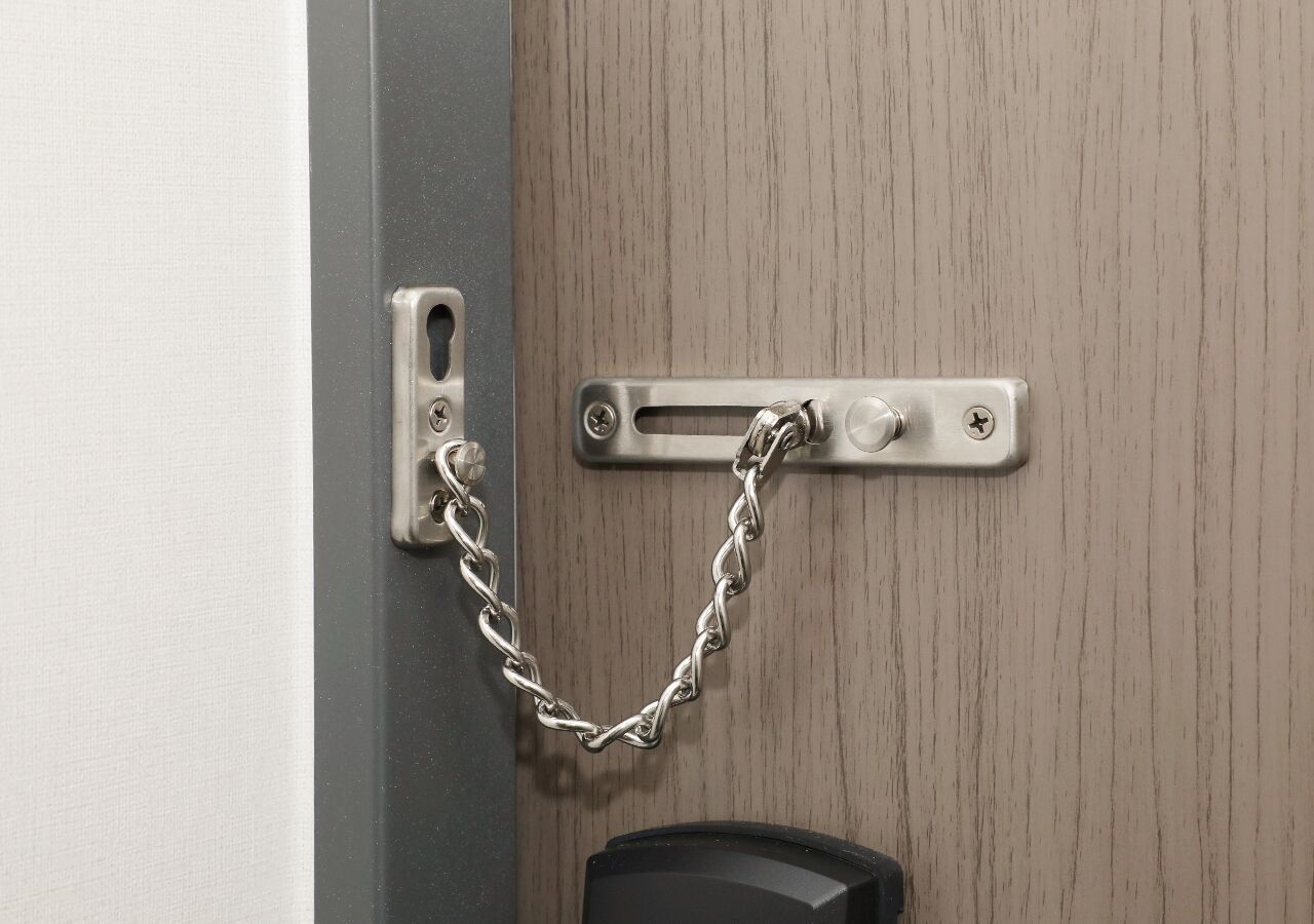 A door with a chain lock mechanism.
