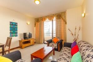 Luxury Apartment, 2 Bedrooms, Balcony, Sea Facing | Living room | Flat-screen TV, fireplace, DVD player, iPod dock