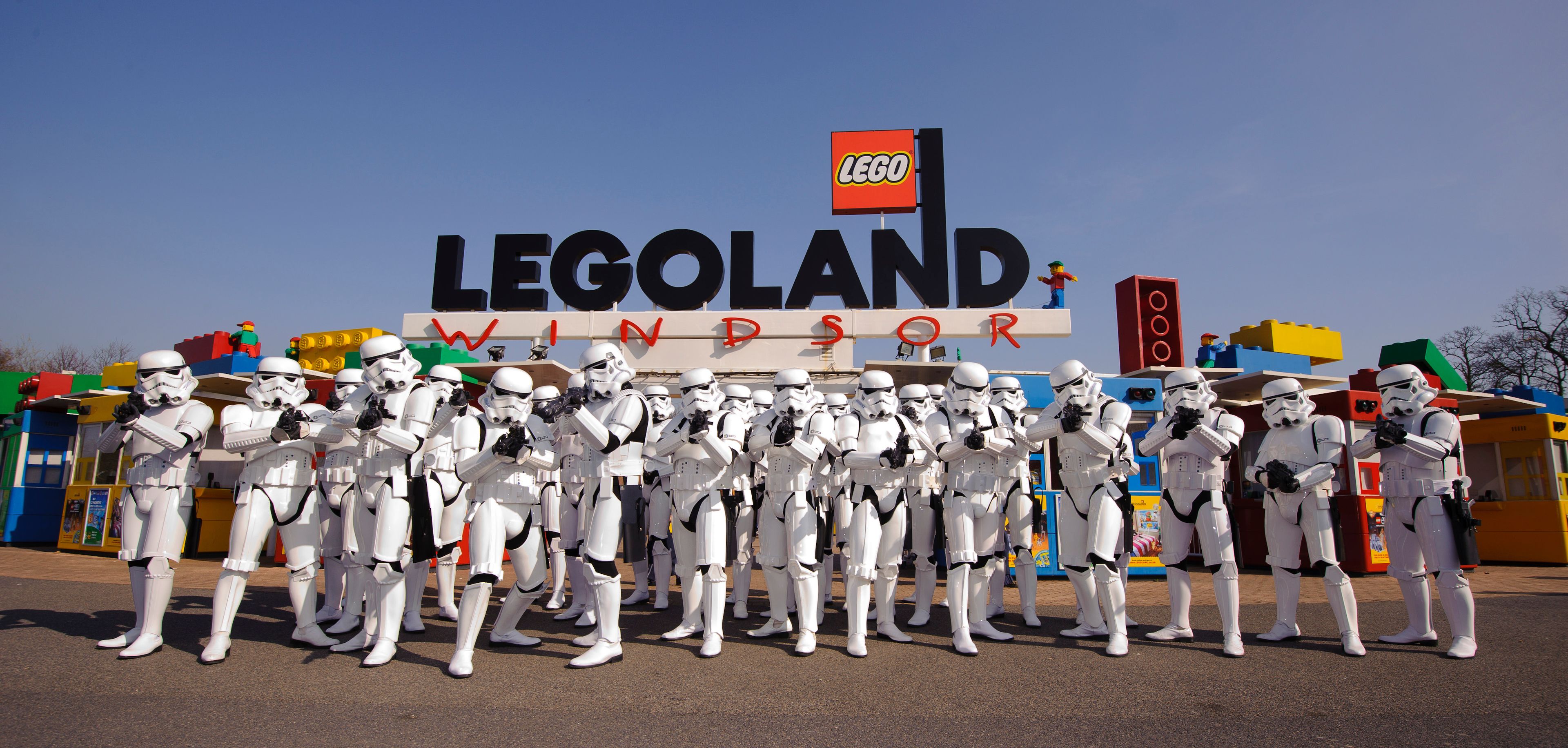 A group of stormtroopers in front of the LEGO Windsor sign.