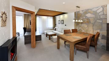 Deluxe Apartment, 1 Bedroom | Living area | Flat-screen TV