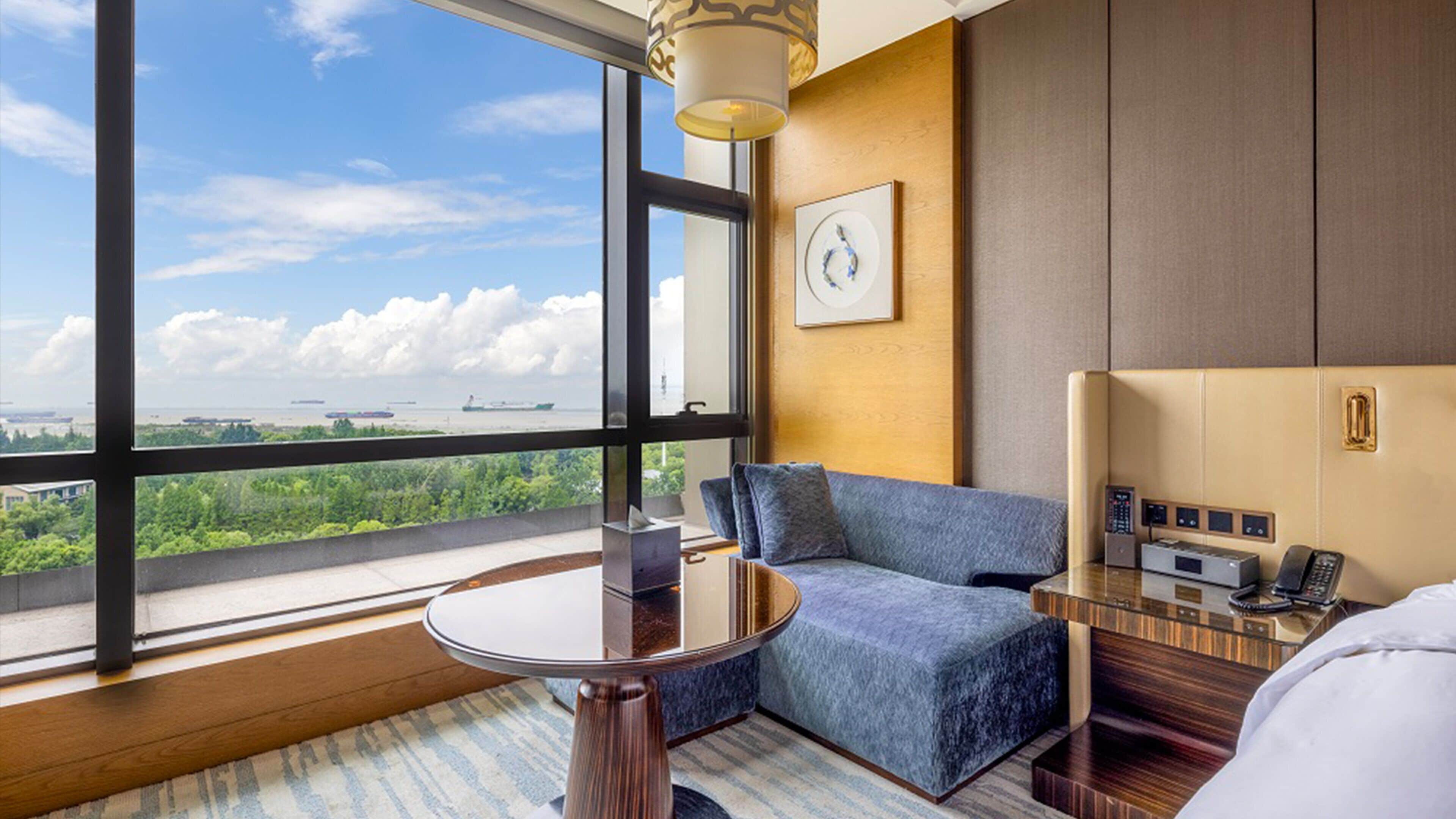 premium room, 1 king bed, river view | 1 bedroom, premium bedding, minibar, in-room safe