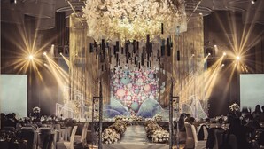 A formal event with a stage, floral decorations, and a seated audience. - InterContinental Nantong by IHG (Nantong)