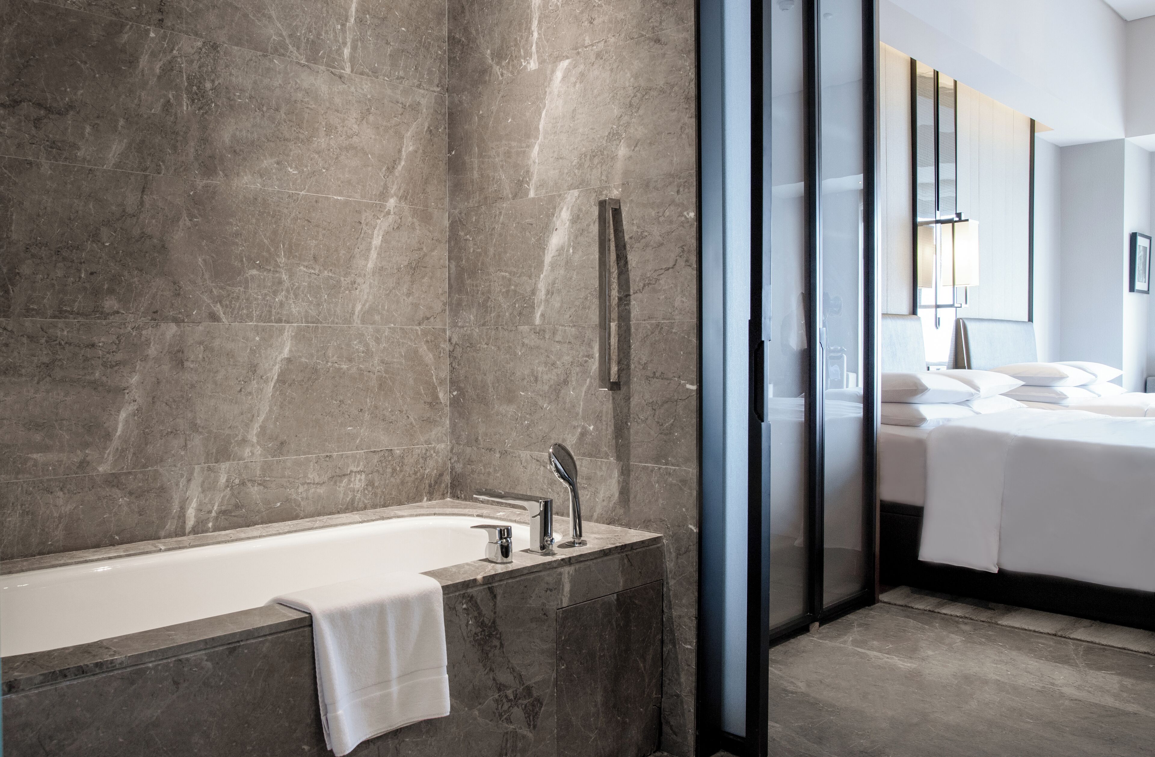 separate bathtub and shower, deep-soaking bathtub, designer toiletries