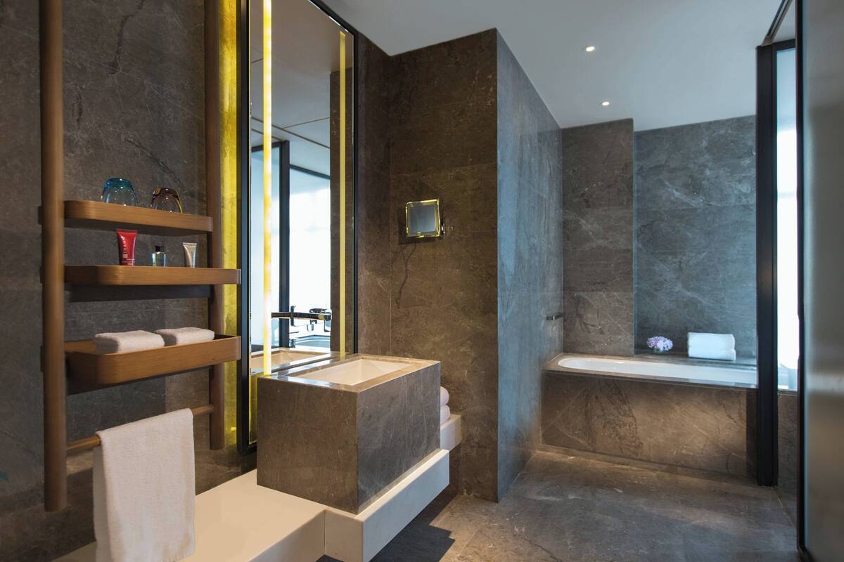 separate bathtub and shower, deep-soaking bathtub, designer toiletries