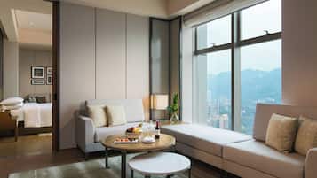 Executive Suite, 1 Bedroom, Non Smoking | Living room | 50-inch LCD TV with satellite channels, TV