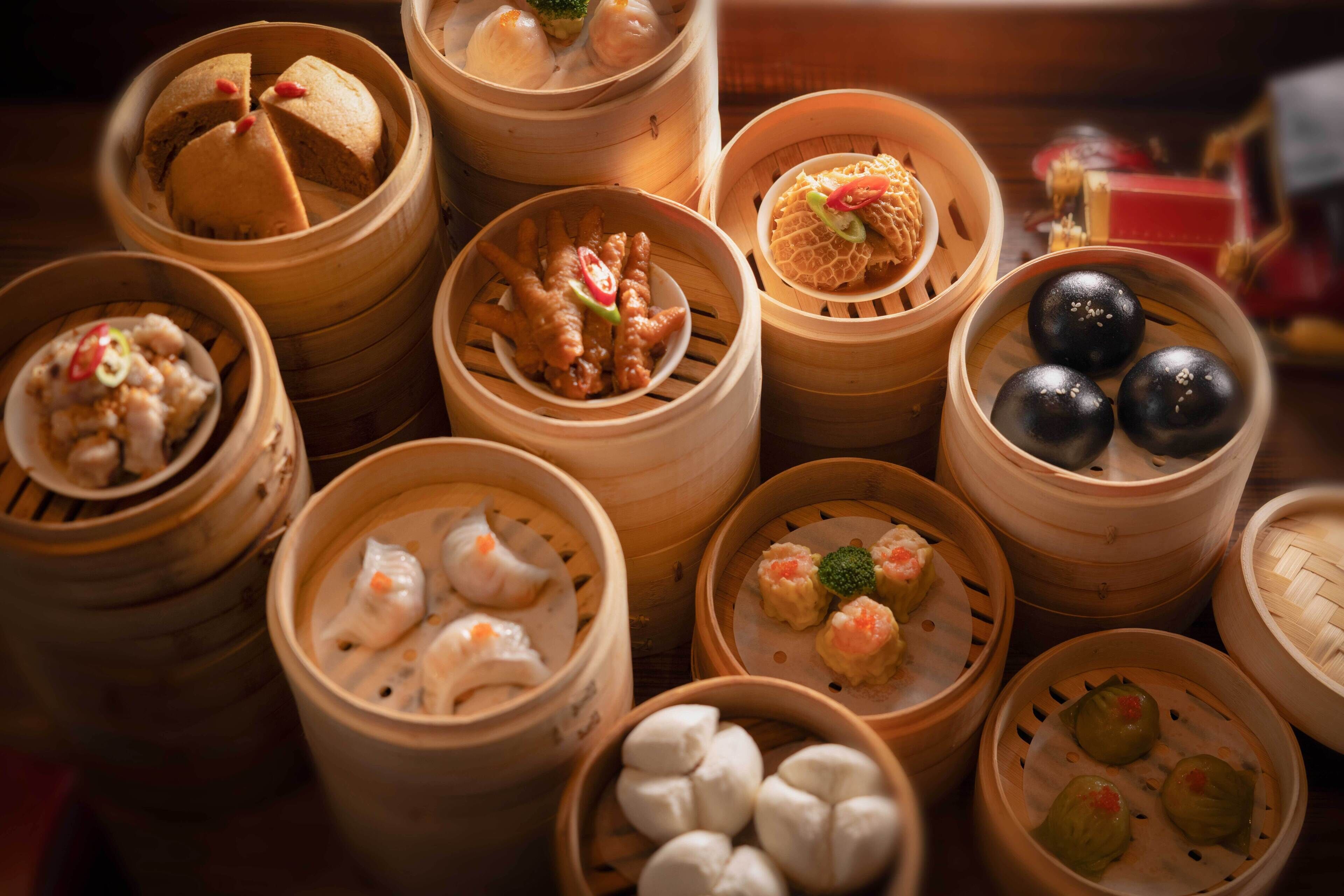Various types of dim sum in bamboo steamers.