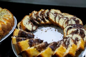 A circular arrangement of sliced bread with a chocolate swirl pattern.