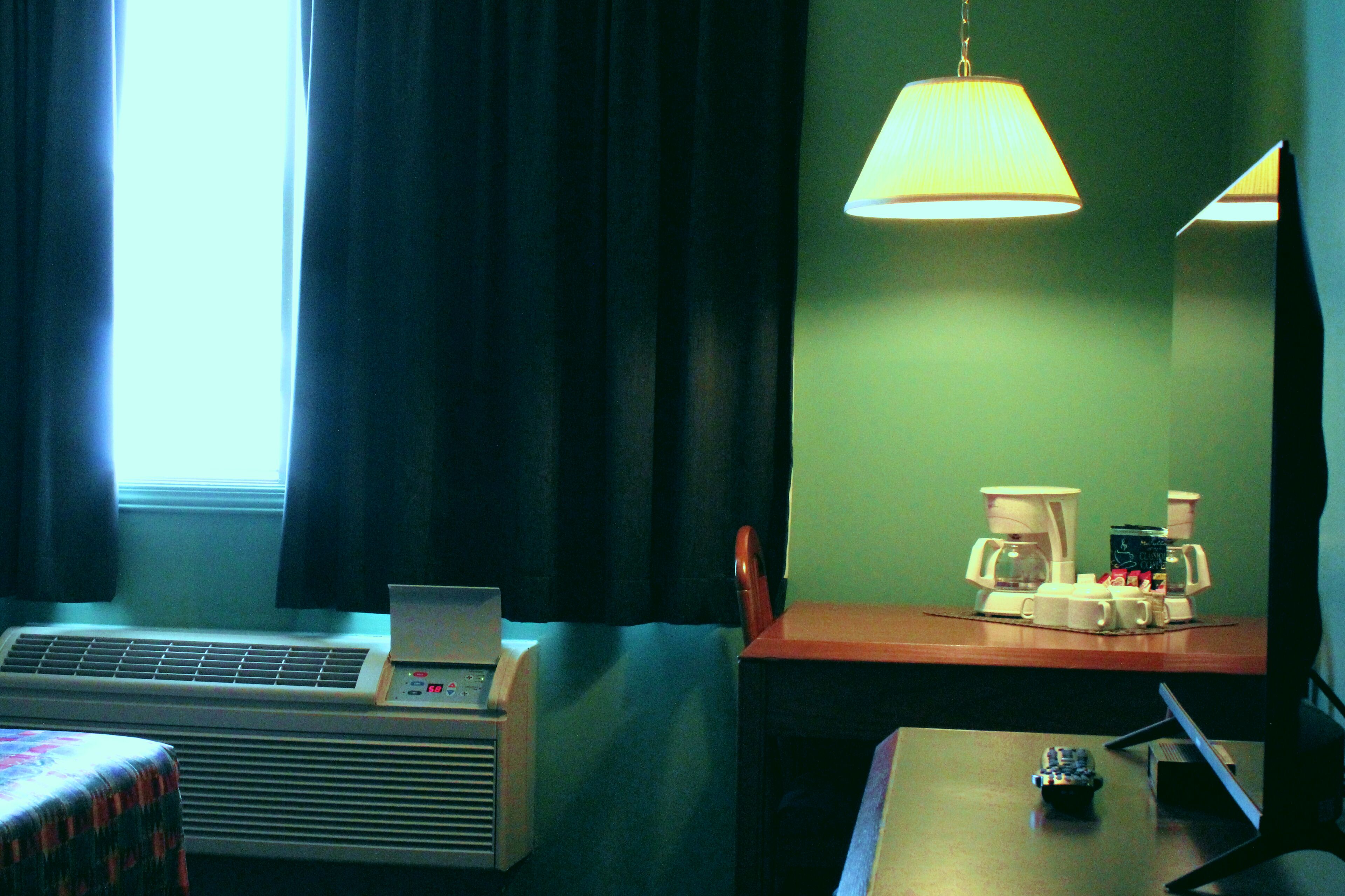 economy room, 1 queen bed, non smoking, refrigerator | 1 bedroom, desk, laptop workspace, blackout curtains