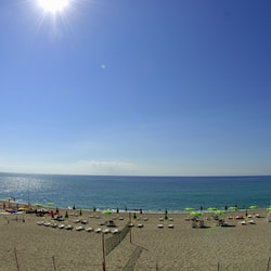 On the beach, sun-loungers, beach umbrellas