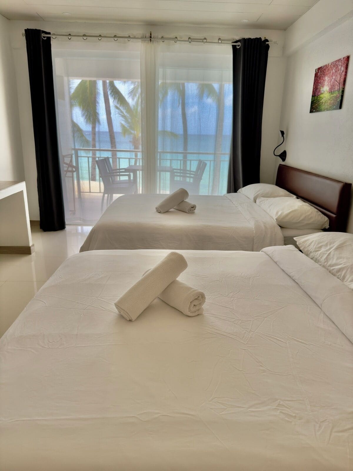 premier double room, 2 queen beds, balcony, sea view | minibar, in-room safe, blackout curtains, bed sheets