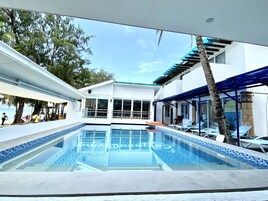 Outdoor pool, open 7:00 AM to 10:00 PM, pool loungers