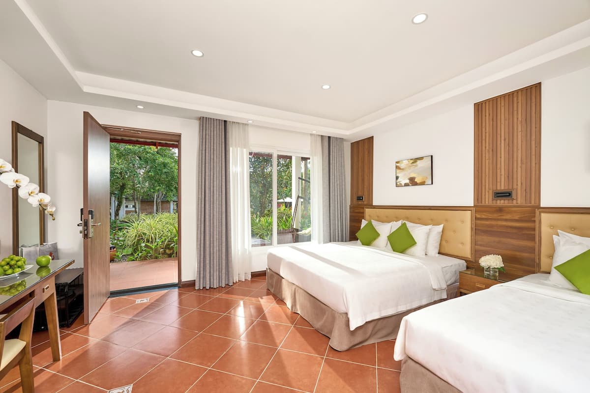 bungalow, pool view (triple) | premium bedding, minibar, in-room safe, desk