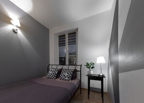 Apartamento conforto, 1 quarto, vista para a cidade | Área de estar | TV de tela plana 40 polegadas com canais a cabo, TV