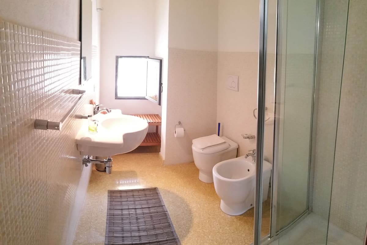 Junior Triple Room, 1 Bedroom, Private Bathroom, Garden View | Bathroom | Shower, bidet, towels
