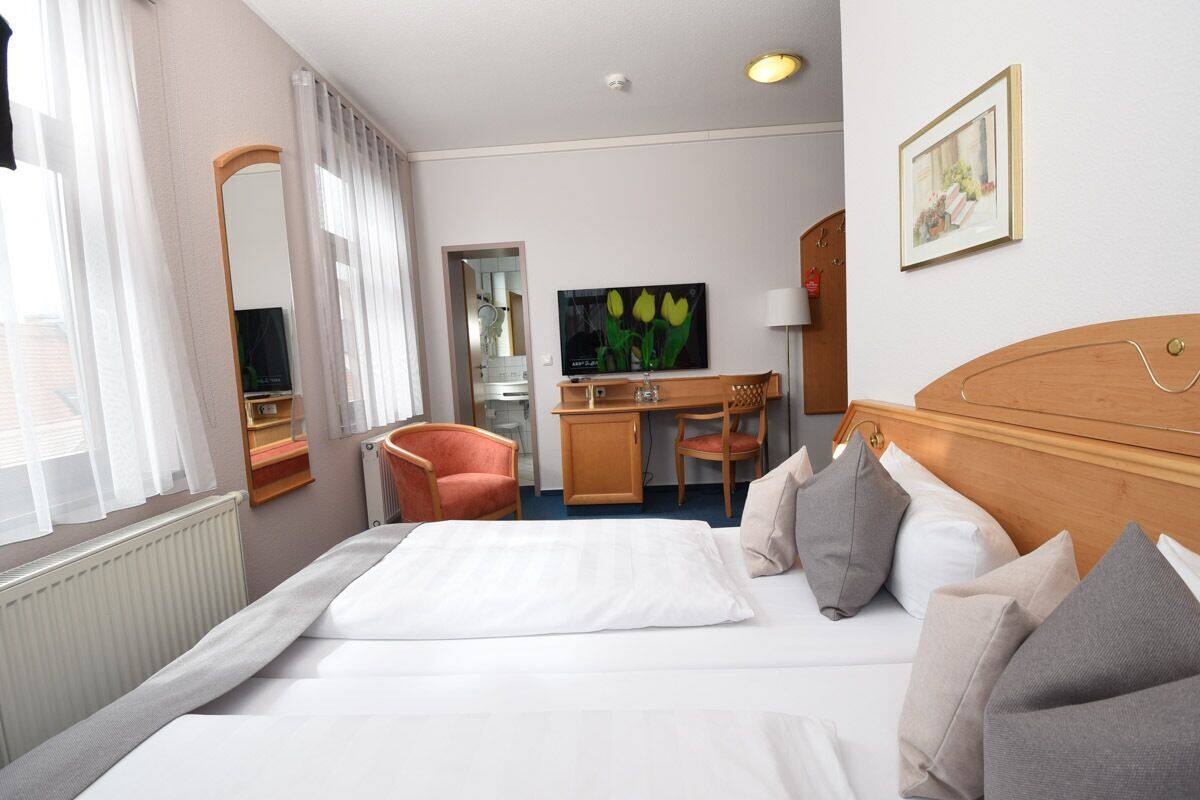 standard room | hypo-allergenic bedding, desk, blackout curtains, cots/infant beds