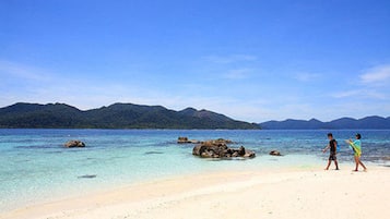 En la playa, toallas de playa