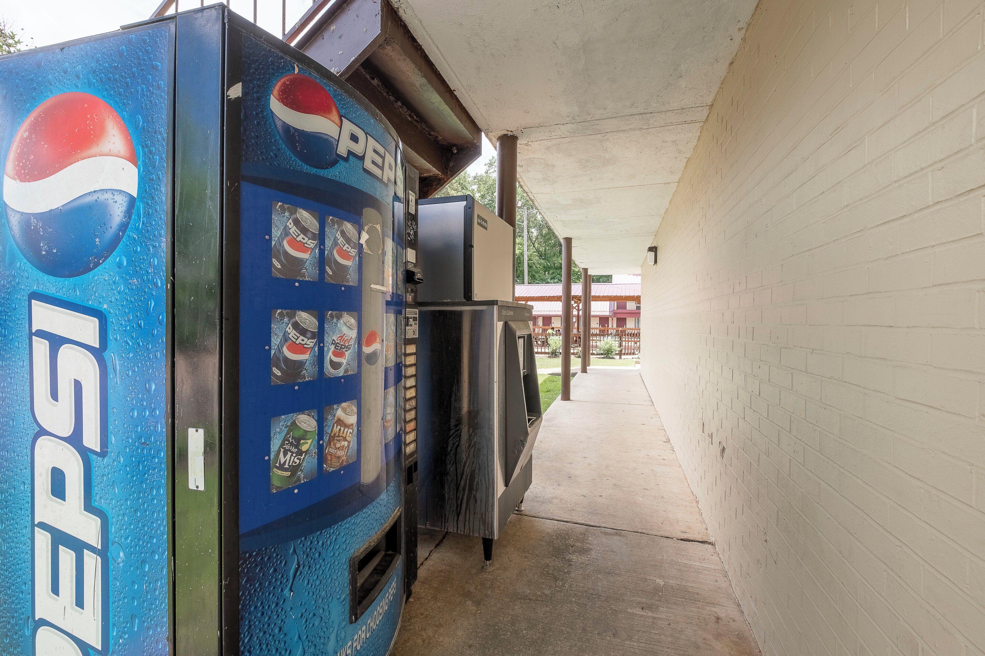 A vending machine with Pepsi branding and various drink options.