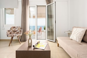 Superior Suite,Terrace, Sea View | Living area | 32-inch LCD TV with satellite channels, TV - Coral Hotel - Hotelia Hospitality Group (Ierapetra)