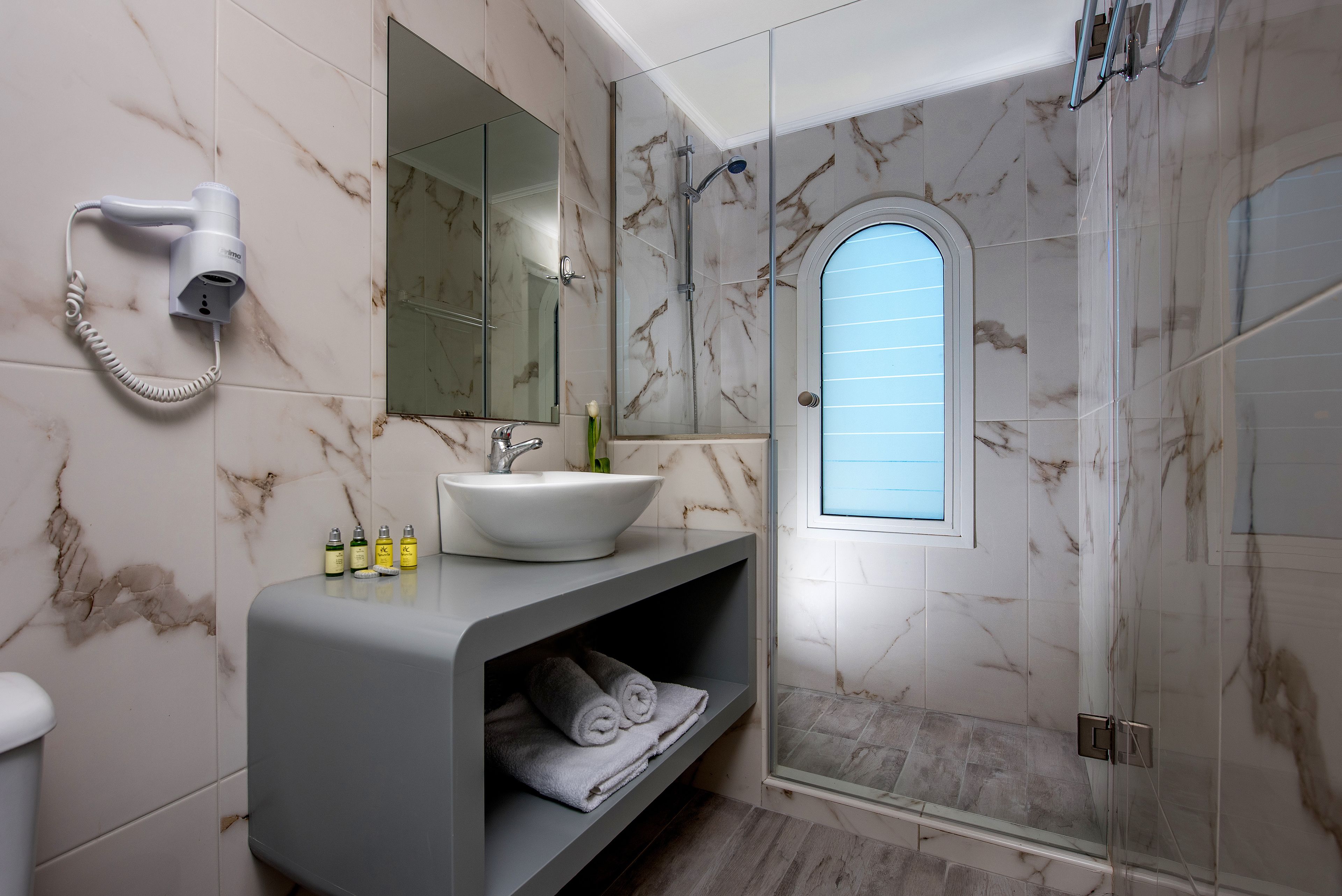 superior room, sea view | bathroom | designer toiletries, hair dryer, slippers