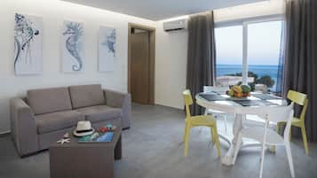 Deluxe Suite with Terrace and Sea View | Living area | LCD TV