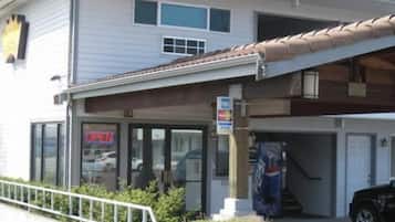 Guests can shop at the storefront on the ground floor, with ample natural light entering through large windows.
