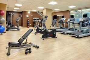A gym with treadmills, elliptical machines, and free weights. - Courtyard Akron Downtown (Akron)