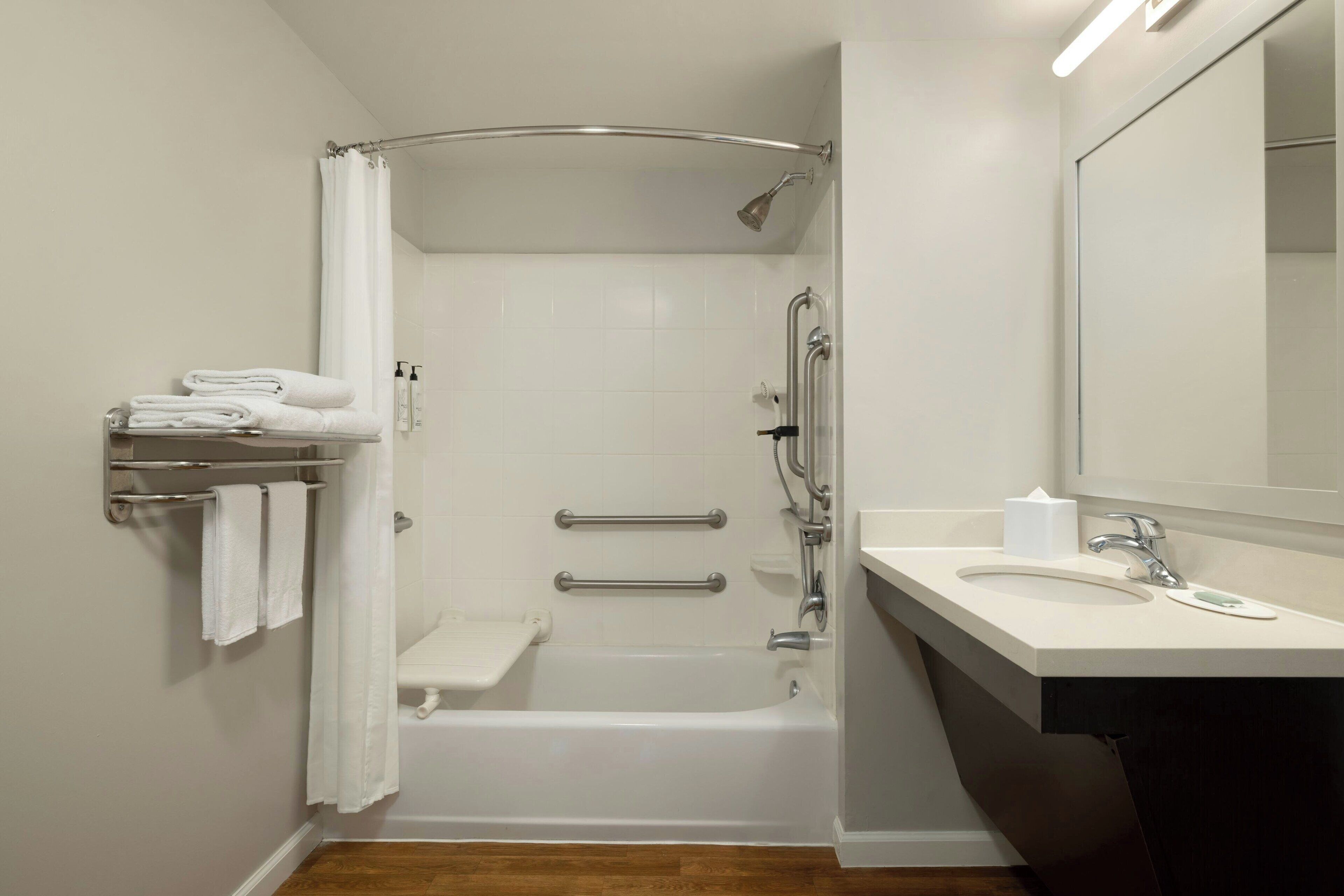 combined shower/bathtub, hair dryer, towels, soap