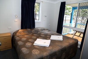 Premium bedding, blackout drapes, iron/ironing board, bed sheets