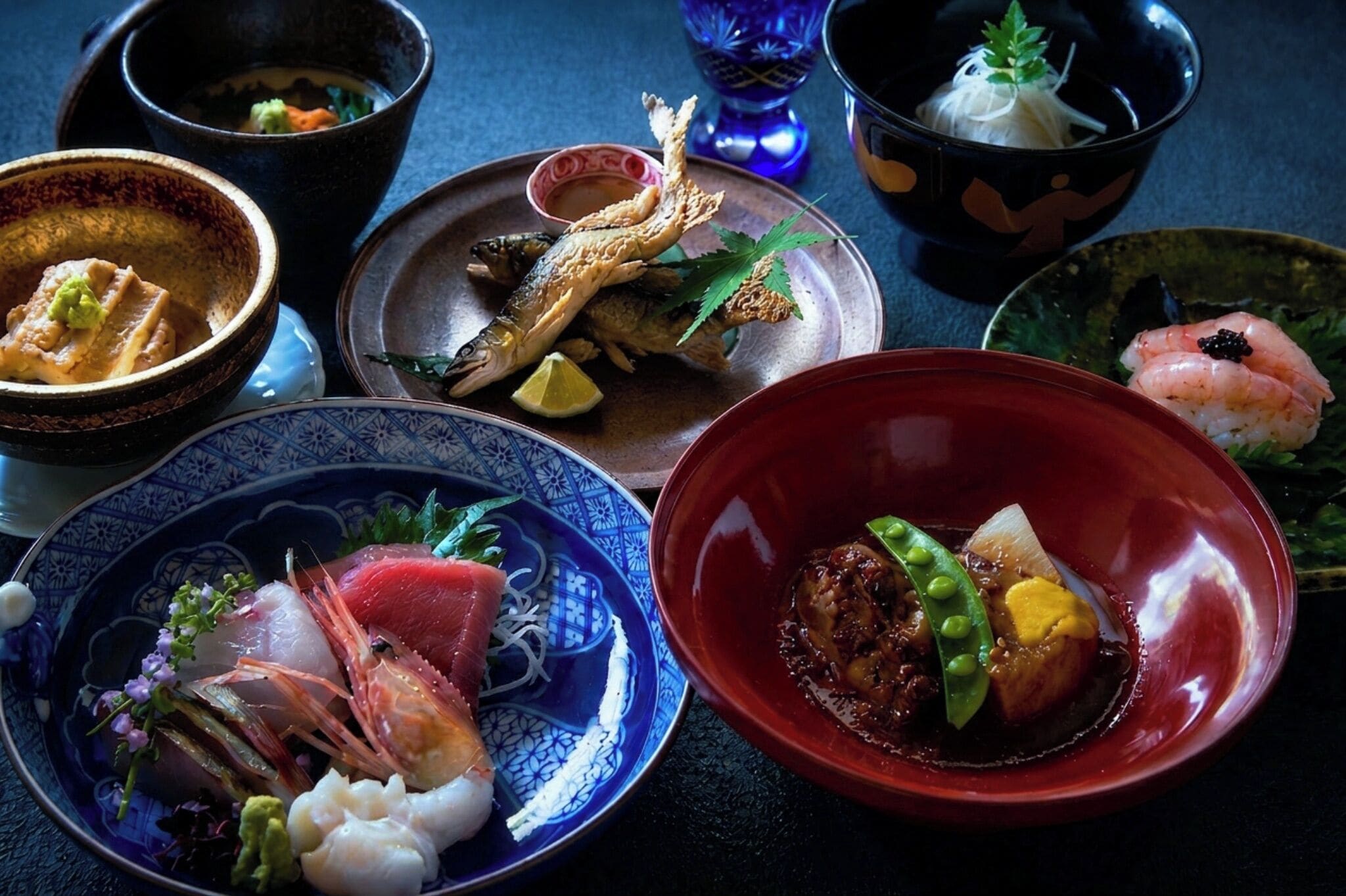 A variety of dishes in different bowls and plates, suggesting a meal setting.