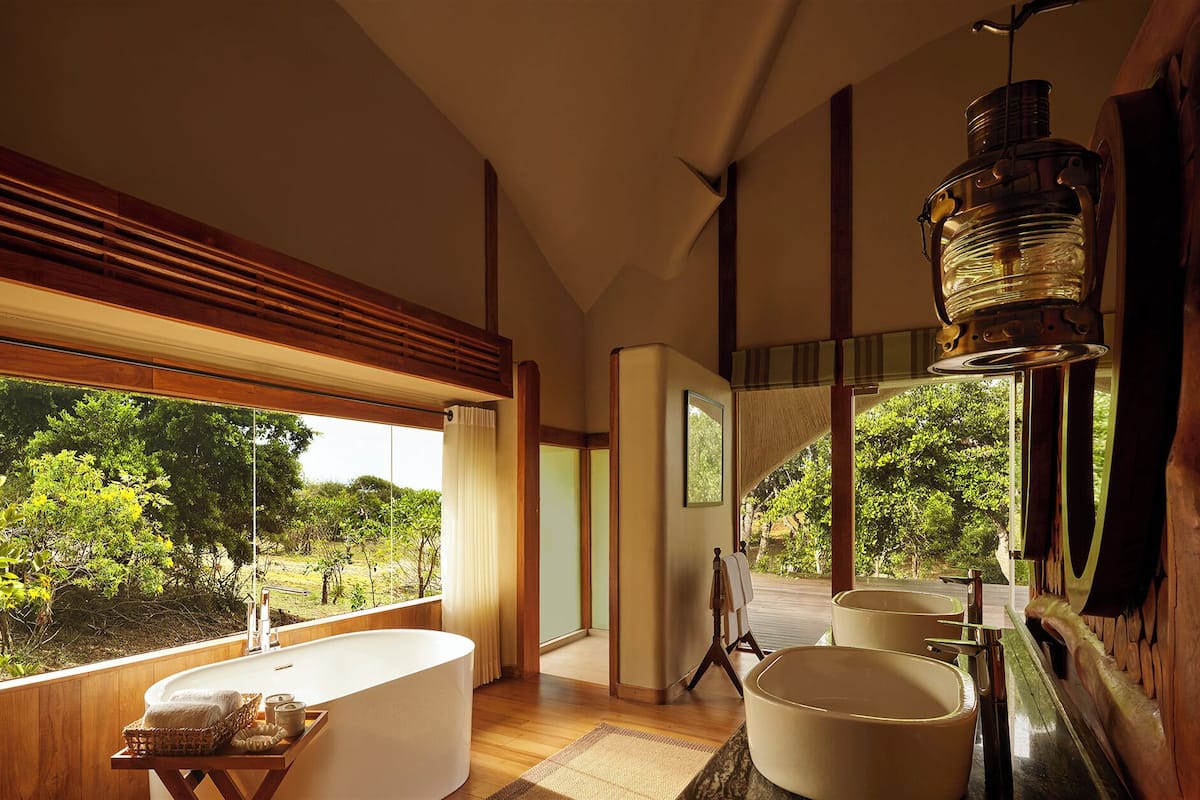 all inclusive luxury cabin with safari | bathroom | separate bathtub and shower, hydromassage showerhead, free toiletries