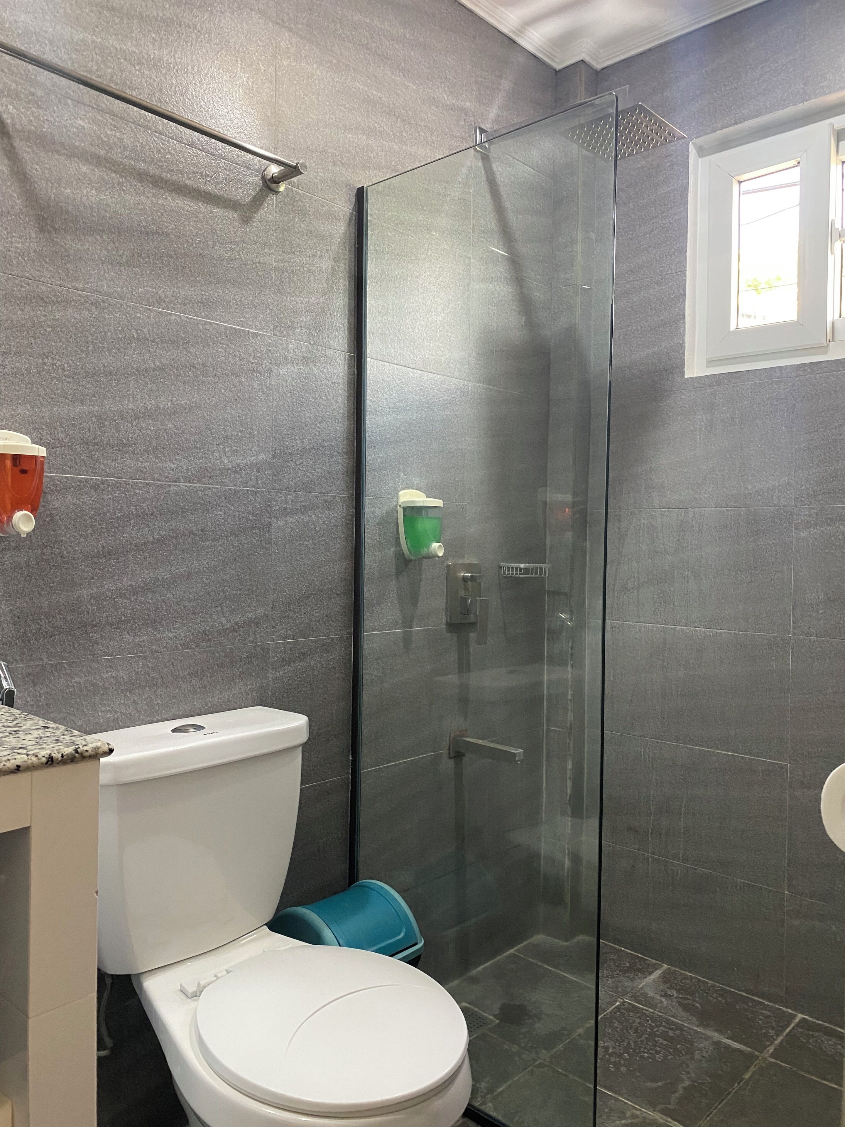 standard room | bathroom | shower, rainfall showerhead, hair dryer, slippers