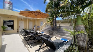 Outdoor pool, open 8:00 AM to 11:00 PM, pool loungers