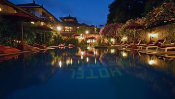 2 outdoor pools, open 7:00 AM to 10:00 PM, pool umbrellas, pool loungers